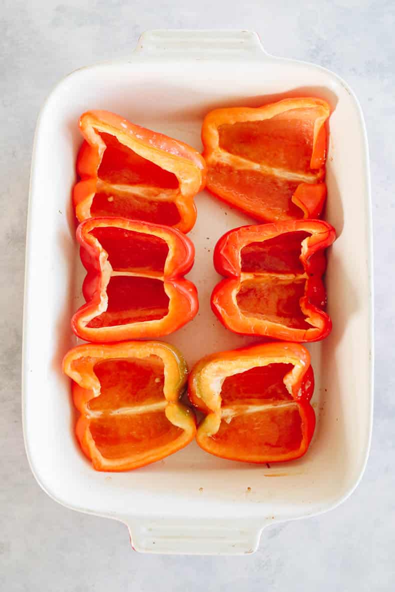 Baked red bell peppers cut in half